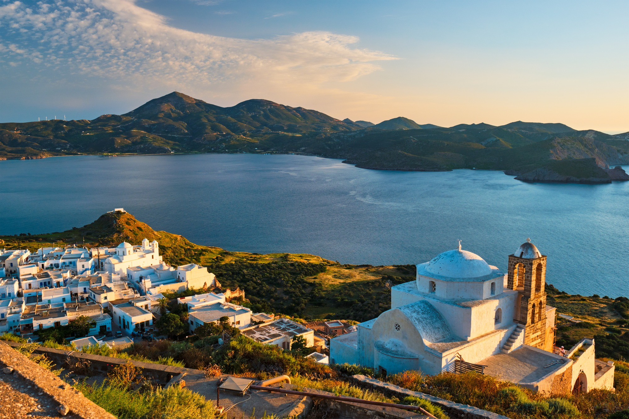 Greek Orthodox church in Plaka village on Milos island on sunset in Greece